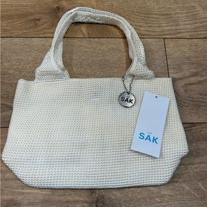 The Sak Cream mini purse